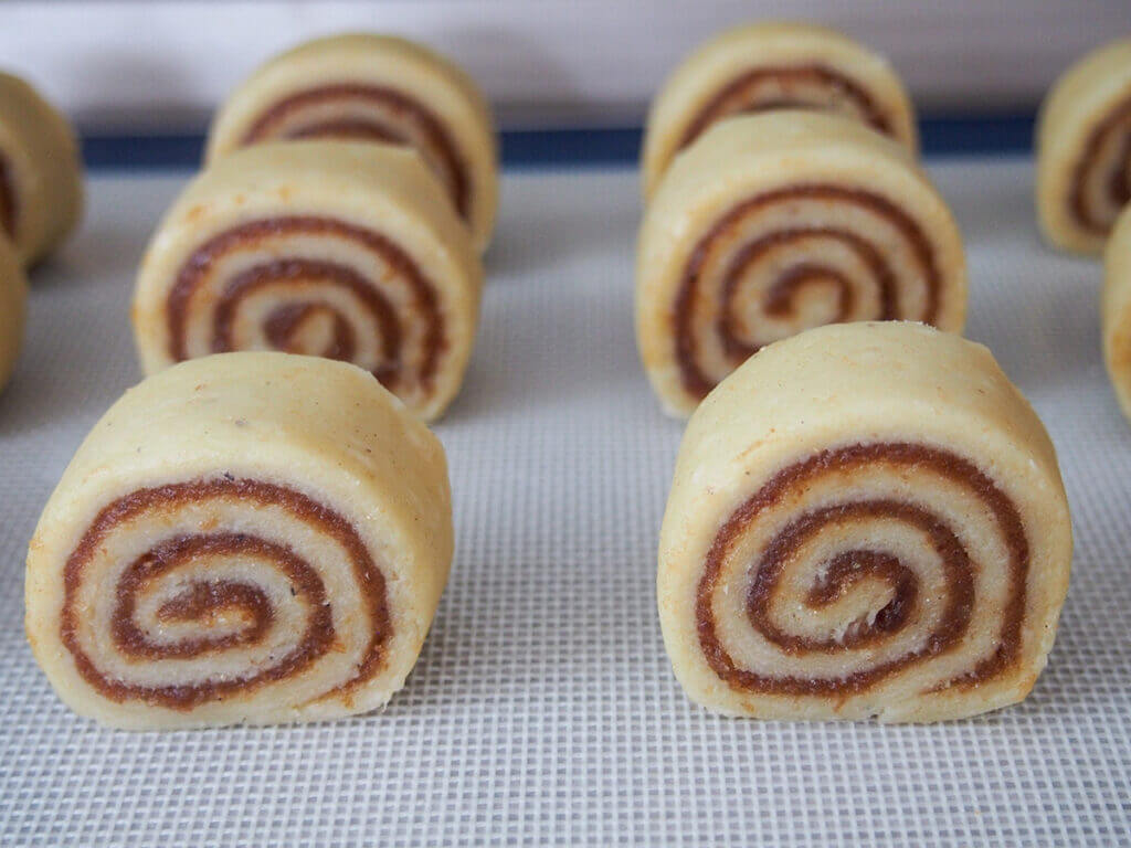 spiral date cookies on baking sheet before baking