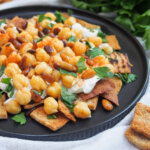 part view of plate of chickpea fatteh from side