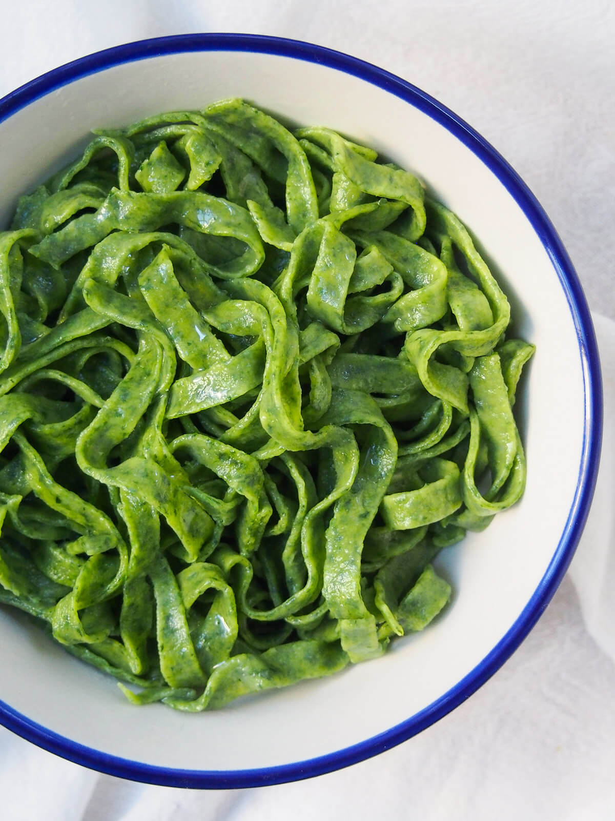 bowl of fresh spinach pasta from overhead