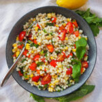 bowl of Israeli couscous salad with grilled vegetables from overhead
