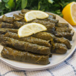 plate of Turkish stuffed grape leaves, yalanci dolma