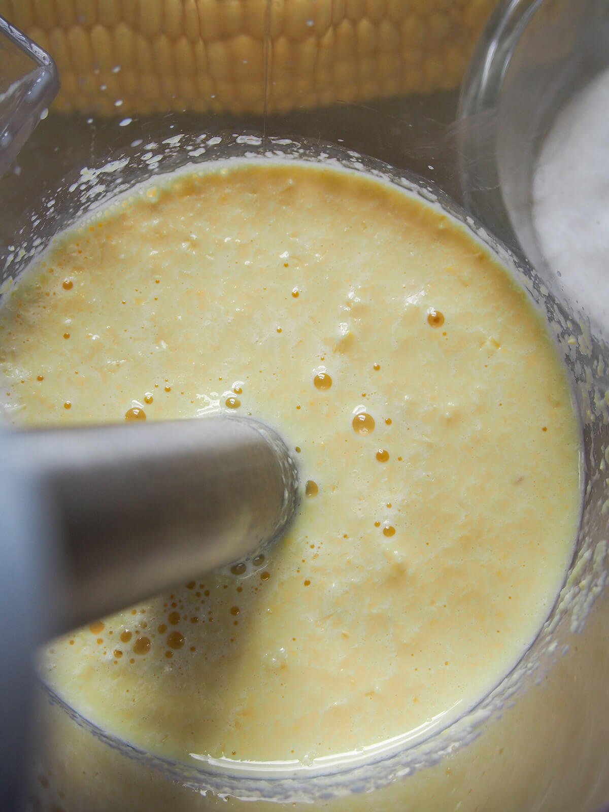 blending corn and milk to a smooth puree