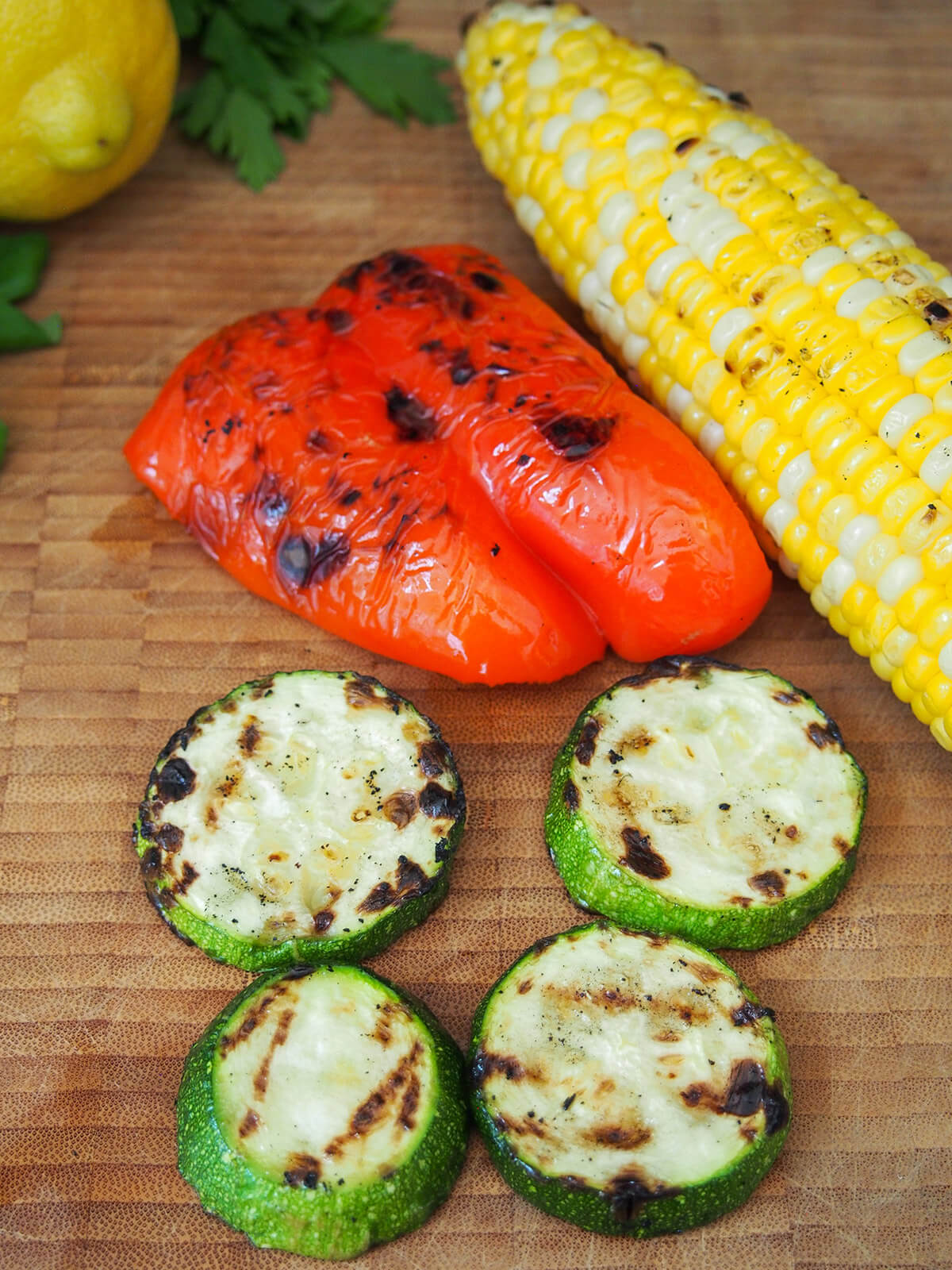 slices of grilled zucchini, chunk of pepper and corn cob