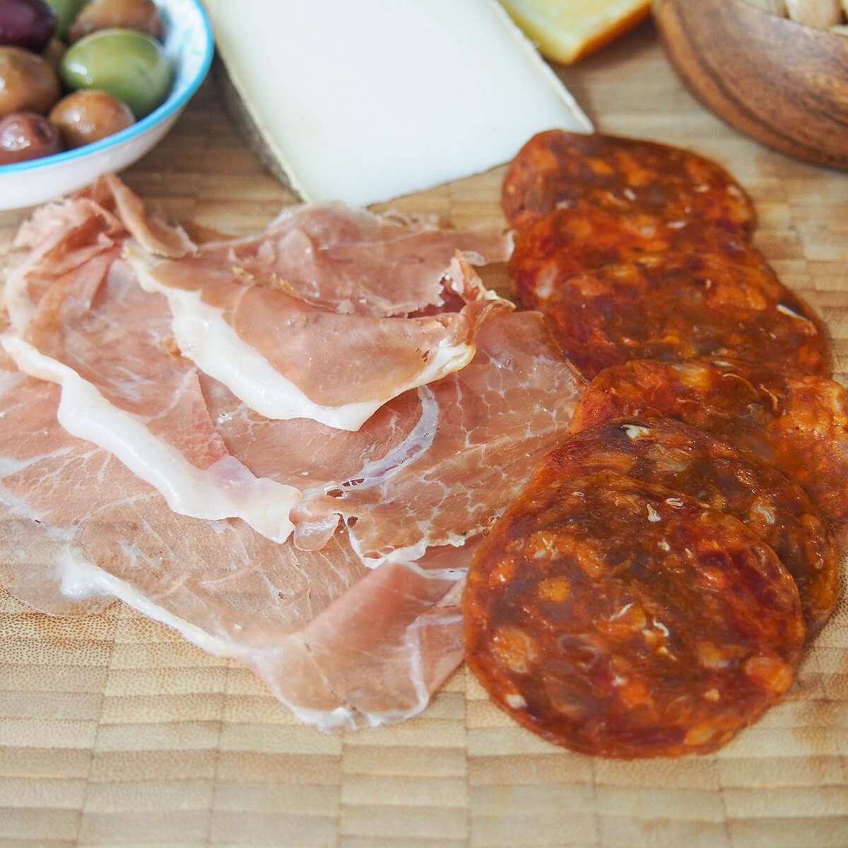 slices of Serrano ham and chorizo