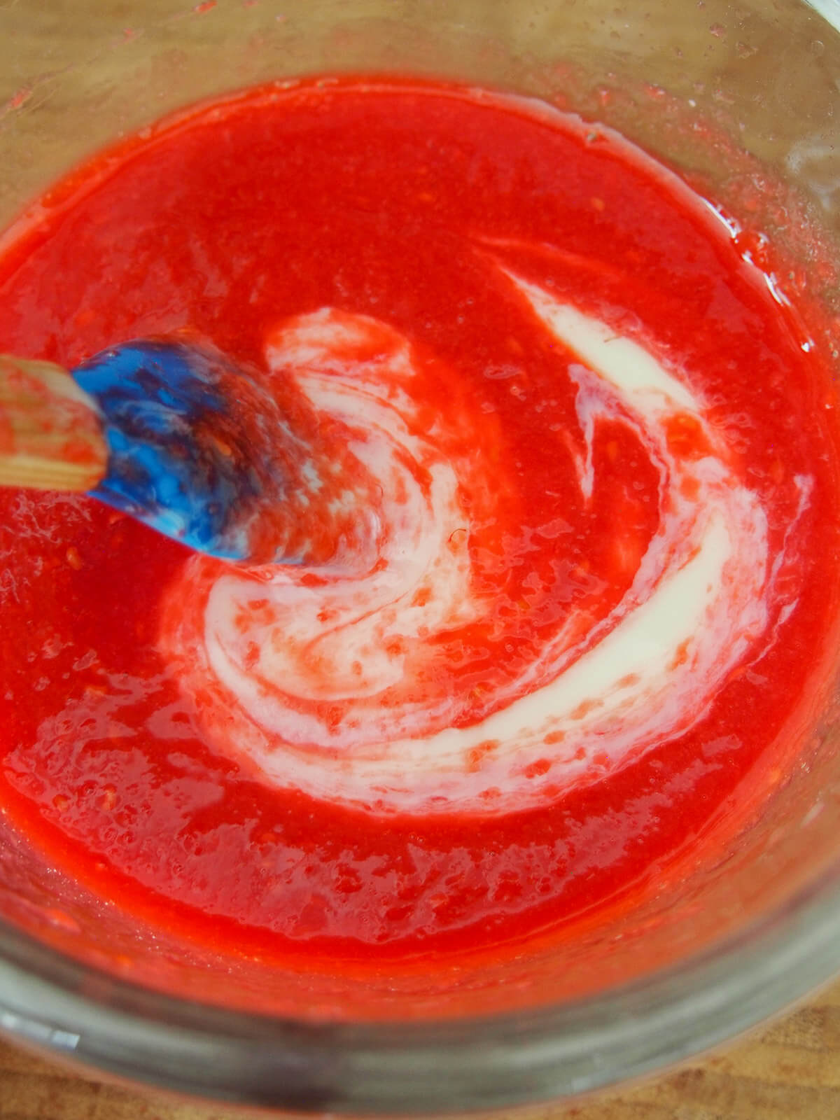 raspberry puree and condensed milk swirled together