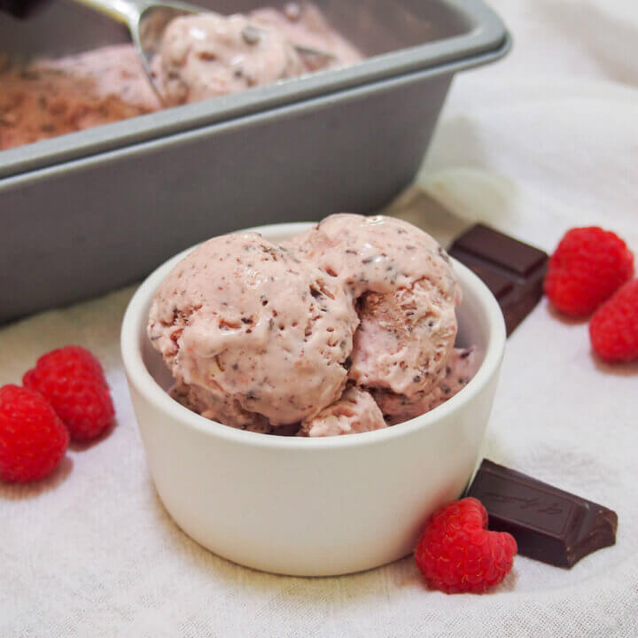 no churn raspberry chocolate chip ice cream in white dish
