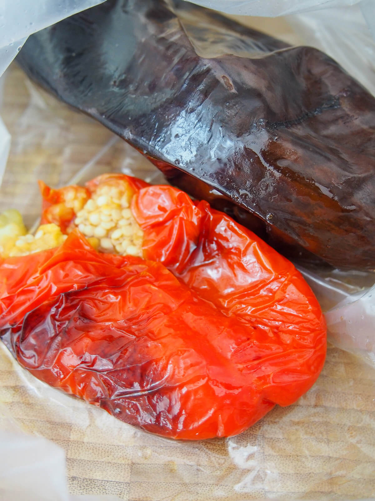 cooked pepper and eggplant in plastic bag to steam and loosen skin