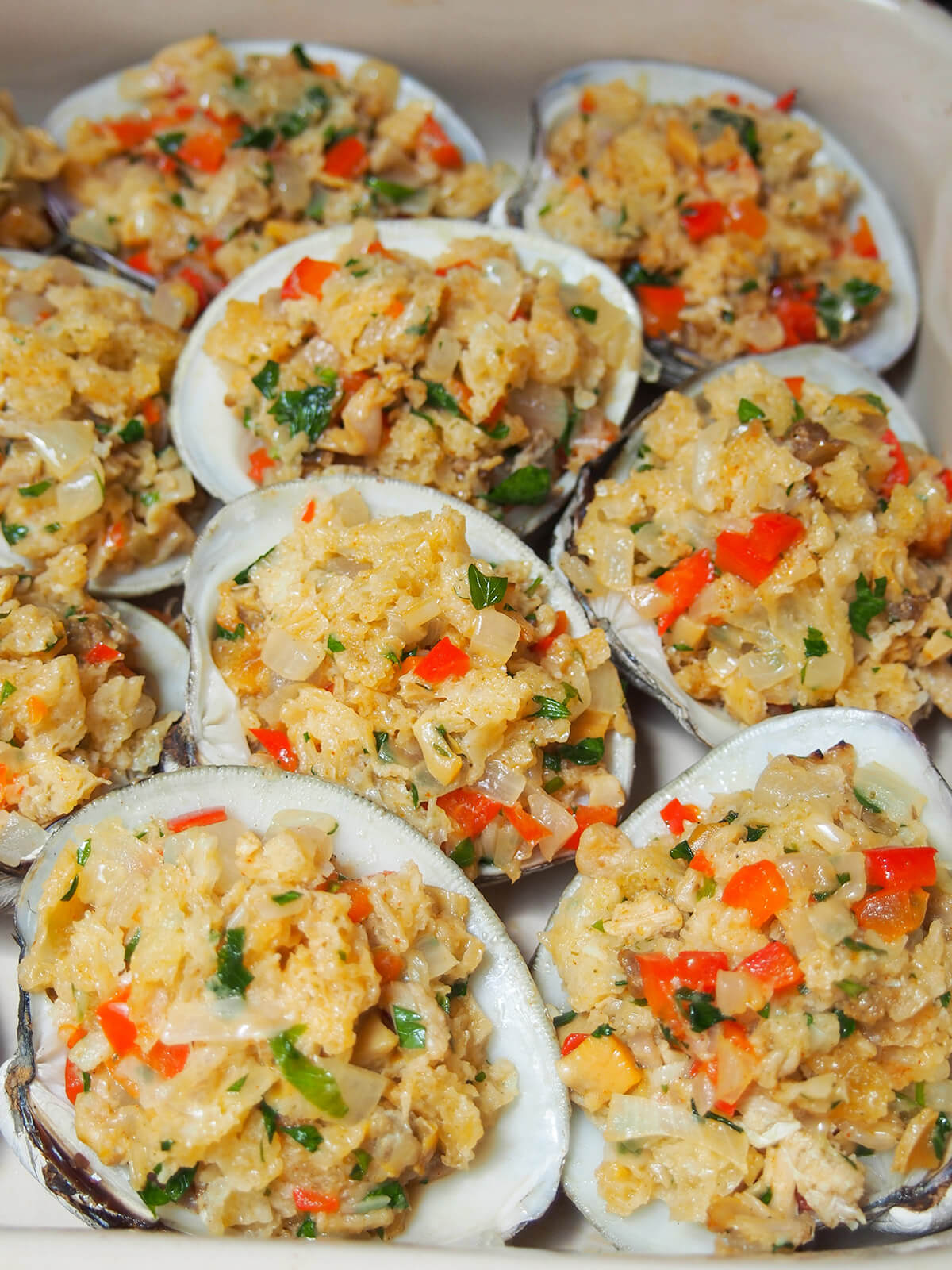 clam shells stuffed with filling before baking in dish