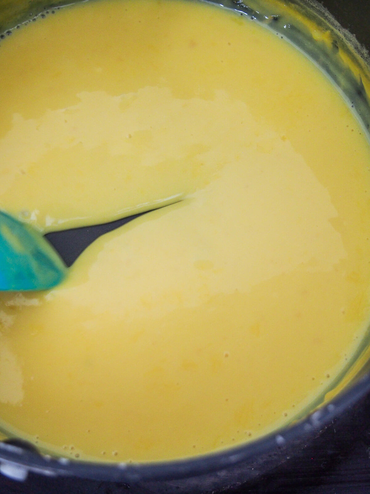 Brazilian corn pudding starting to thicken in pot