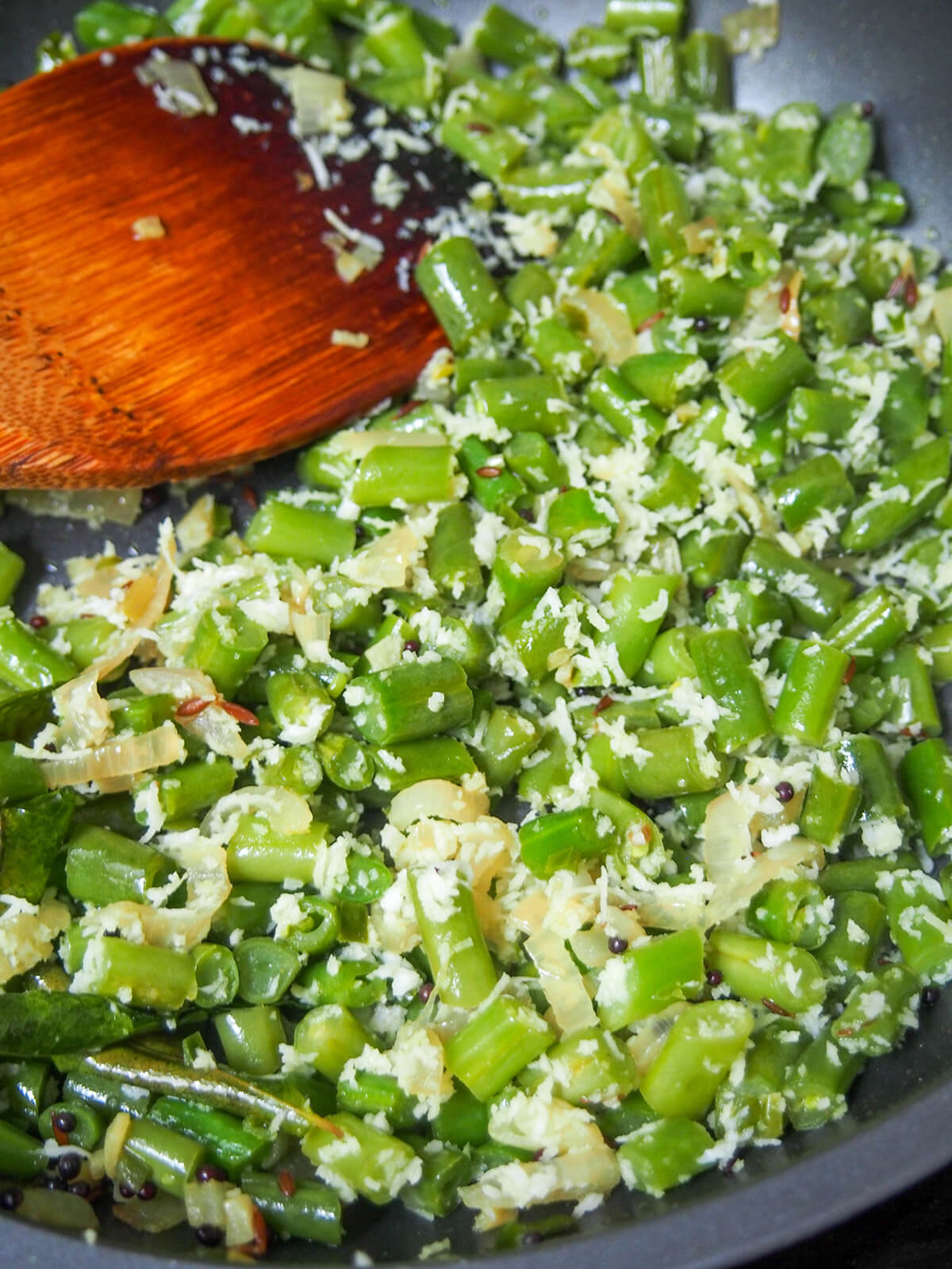cooking beans thoran in skillet