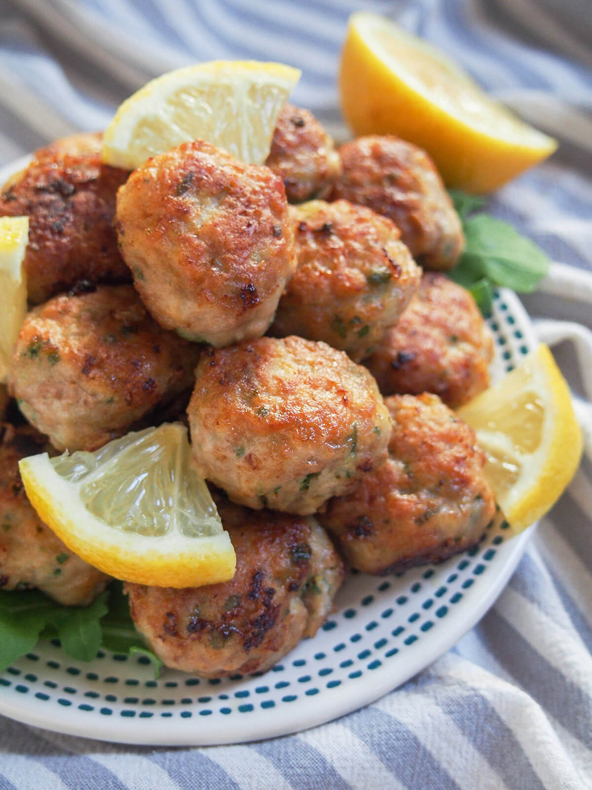 side view of plate of lemon pork meatballs or polpette