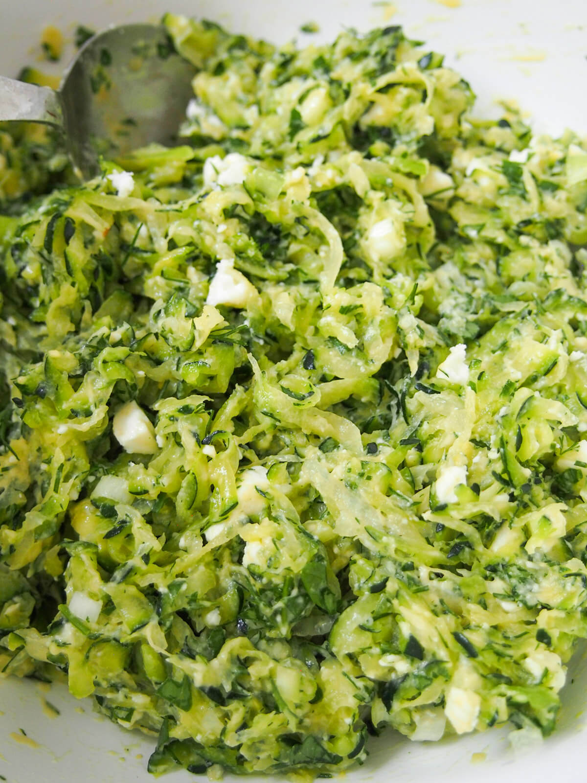 zucchini feta herb mixture in bowl