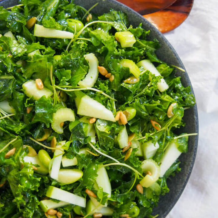 part view of bowl with apple kale salad