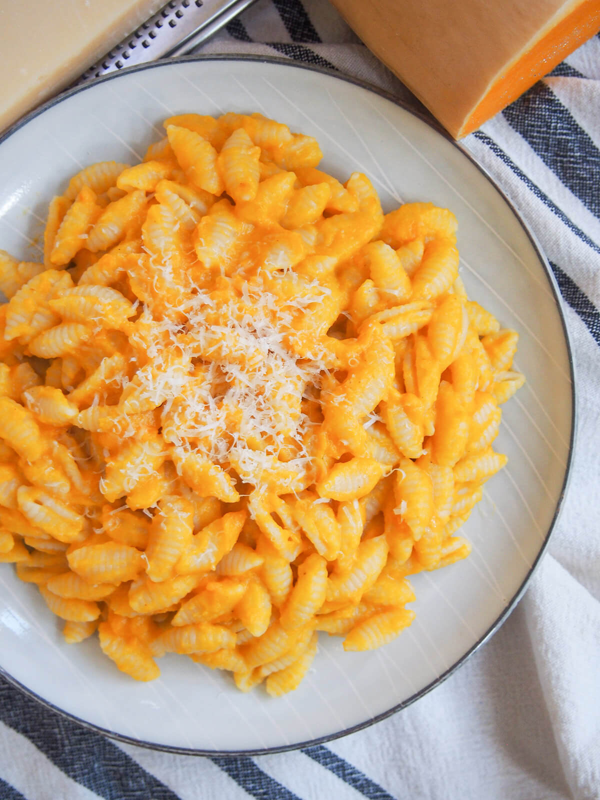 overhead view of butternut squash pasta sauce over pasta