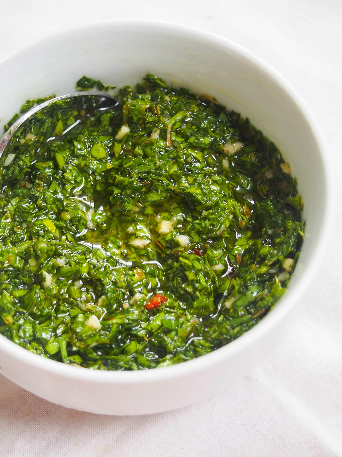 bowl of chimichurri sauce bowl of chimichurri sauce