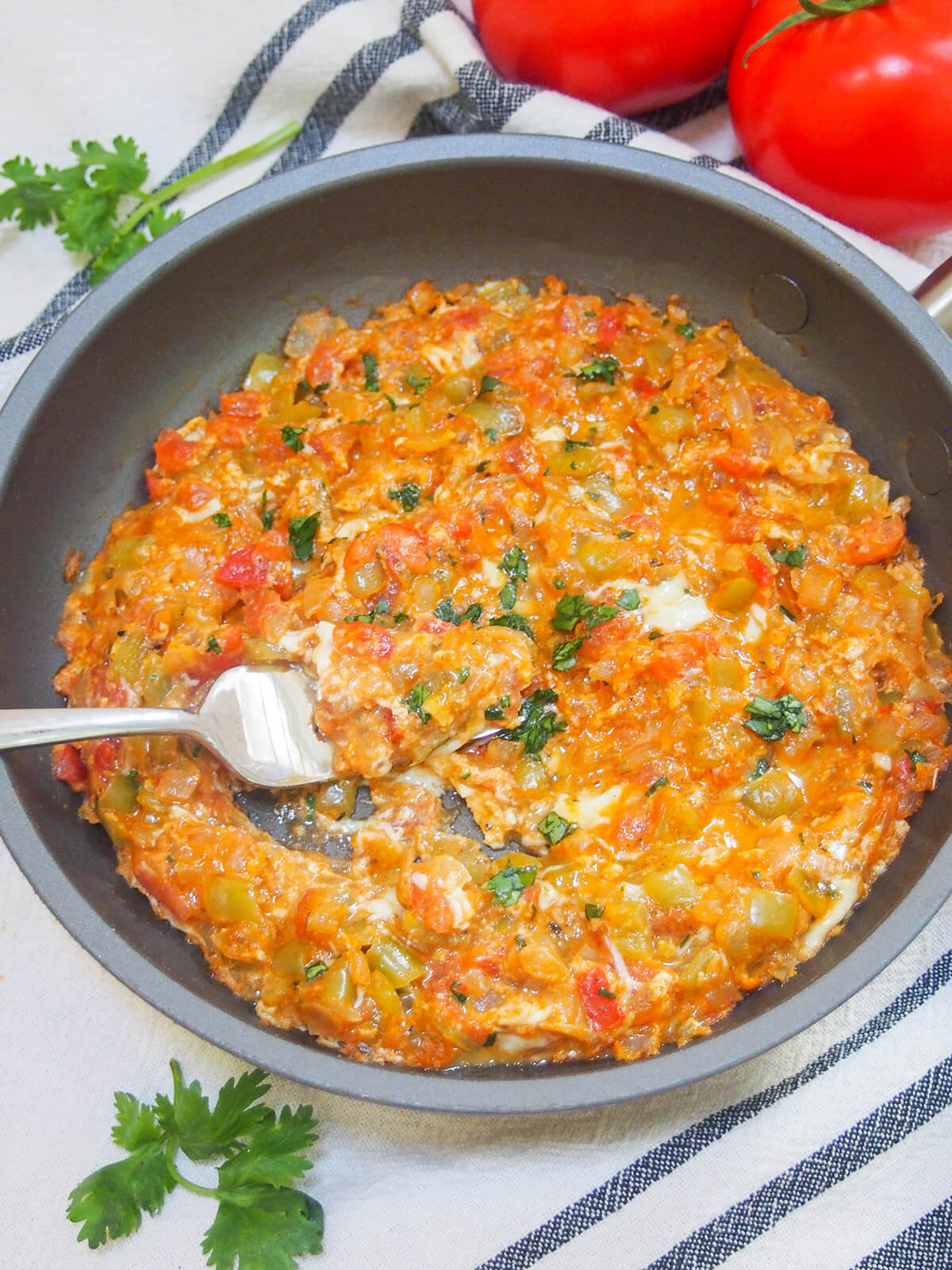 skillet of menemen with fork in middle