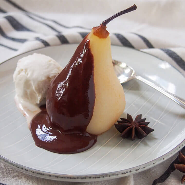 poached pear with chocolate sauce and ice cream aka poires belle Helene