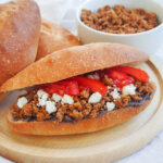 chorizo torta with bowl of chorizo behind