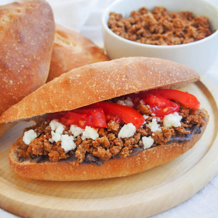 chorizo torta with bowl of chorizo behind
