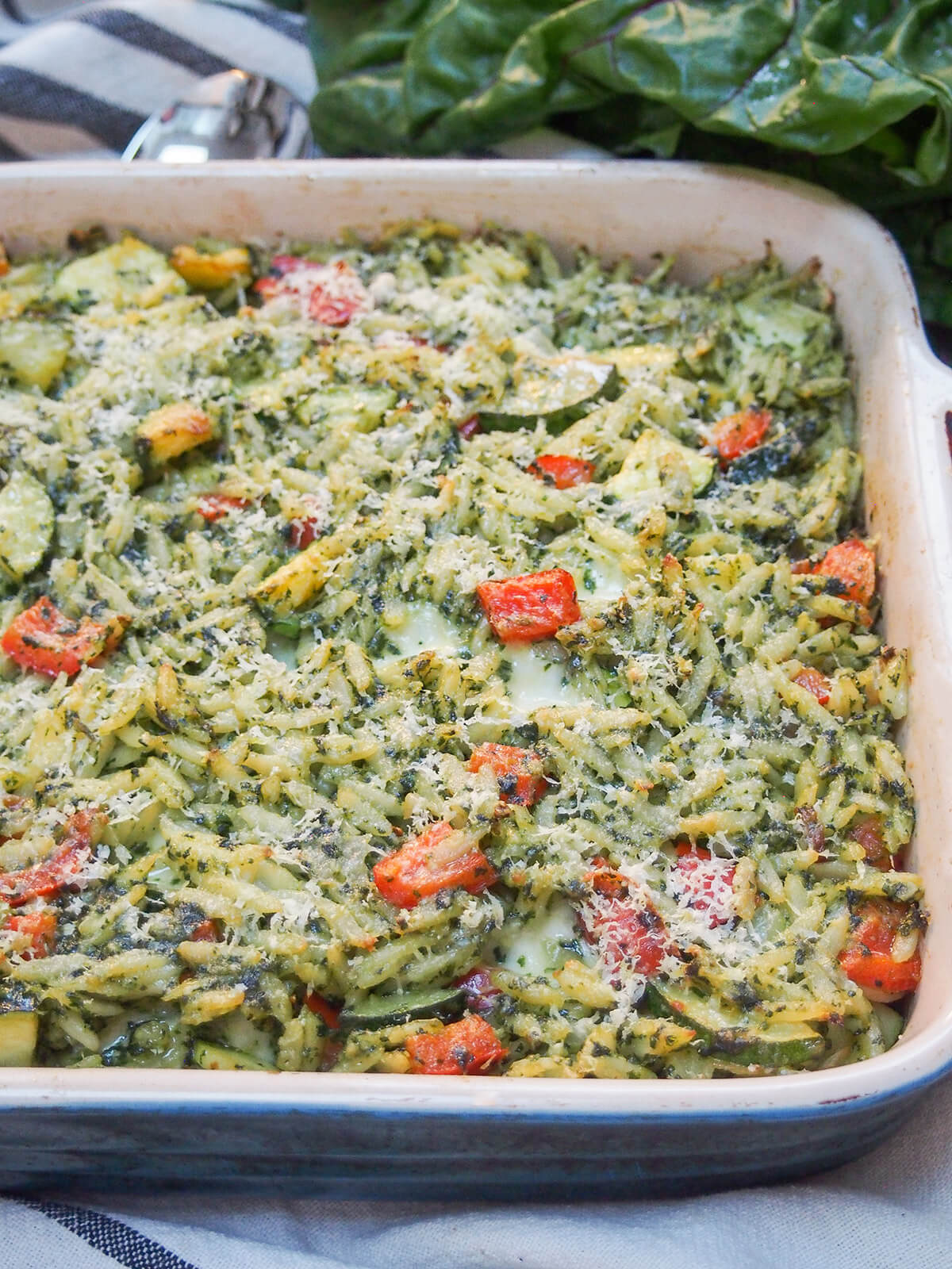dish with creamy chard pesto baked orzo