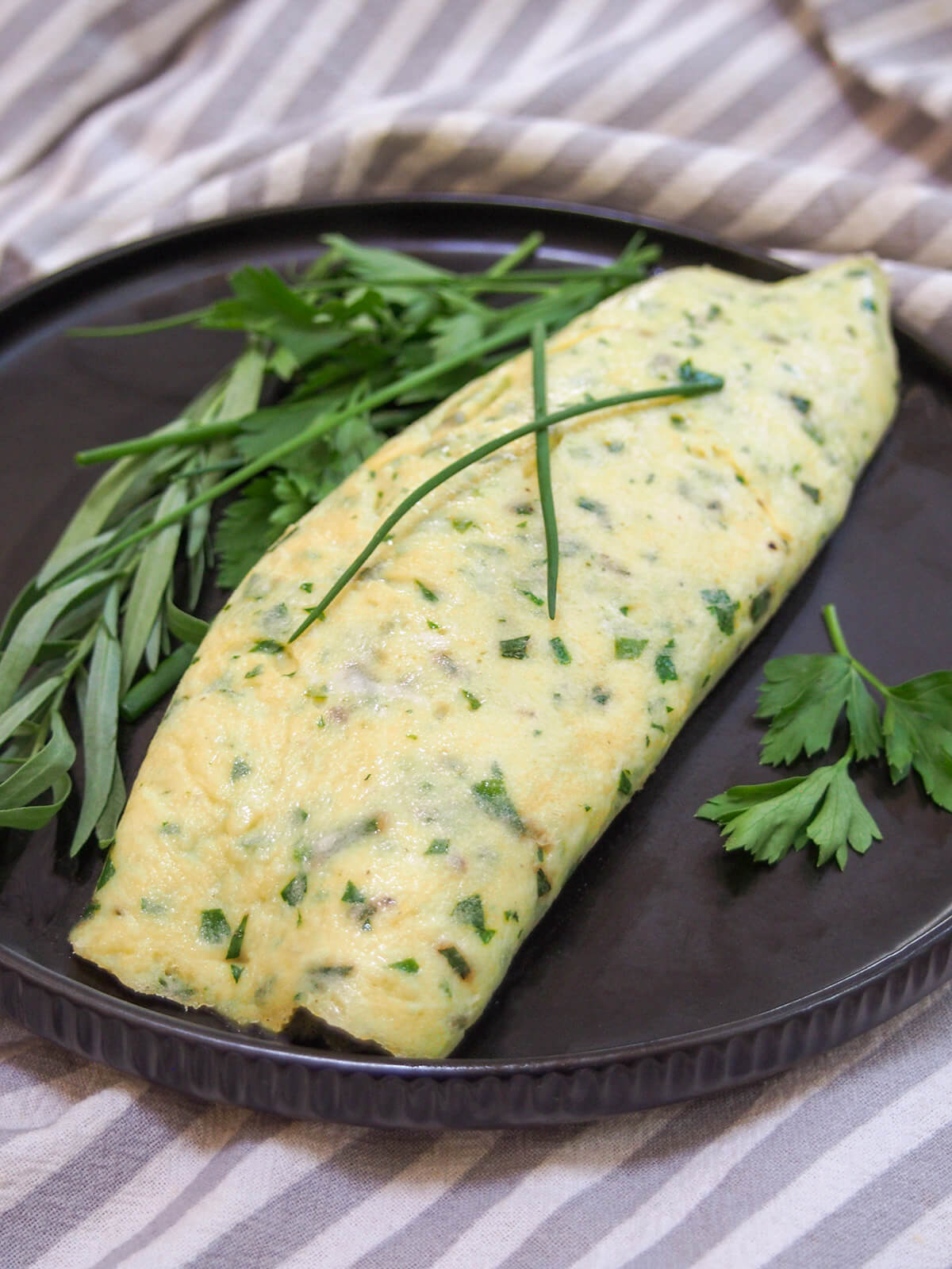 French omelette with herbs topped with chives