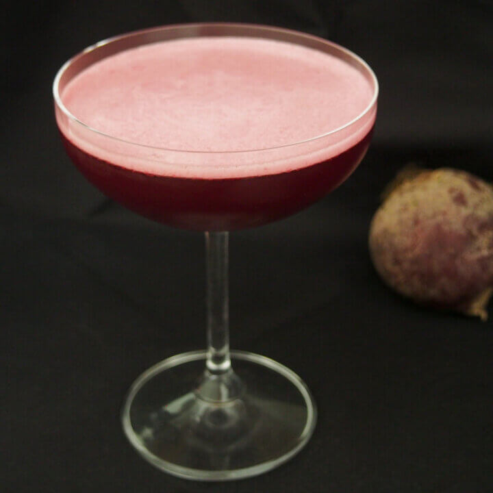 glass of beet negroni sour, a Halloween cocktail