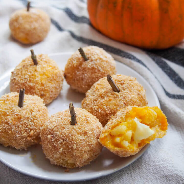 pumpkin arancini with one bitten into to side
