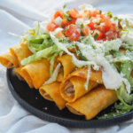 side view of stack of chicken flautas