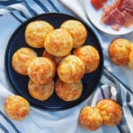 plate of gougeres cheese puffs with a few to side