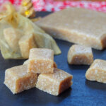 stack of turron de Jijona with block behind and some other cubes to side