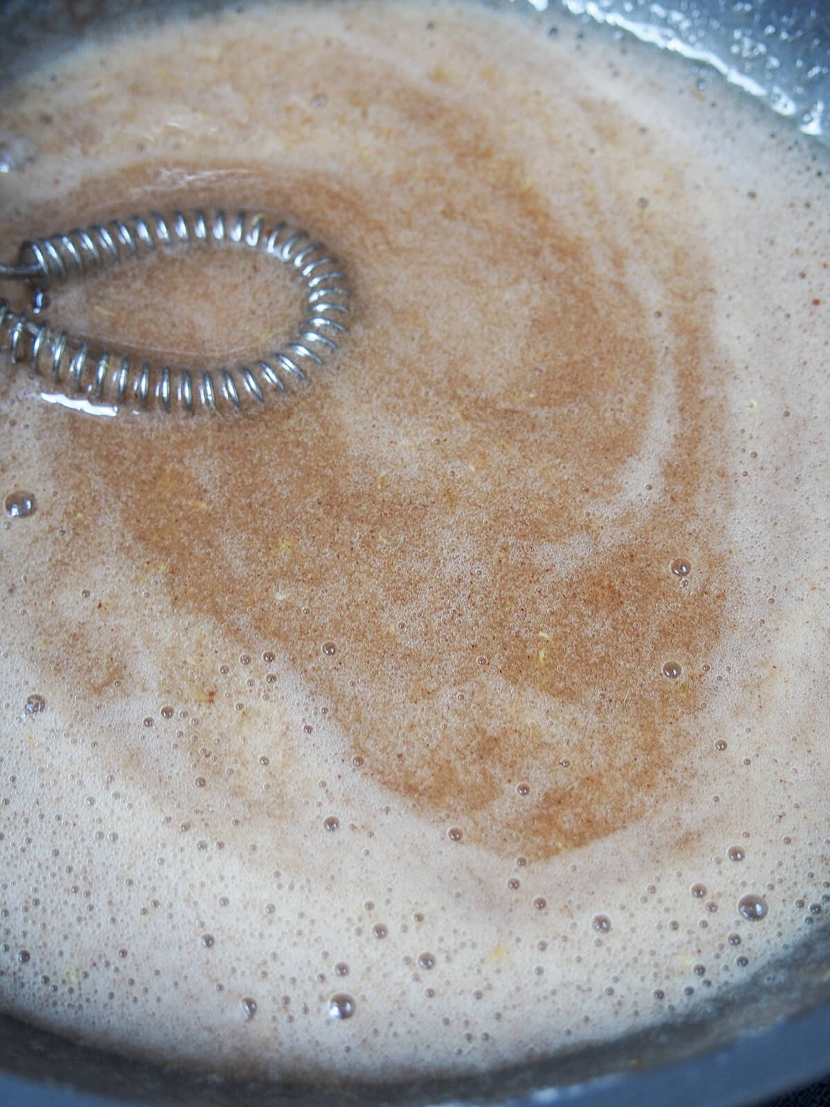 whisking egg white into warm honey mixture