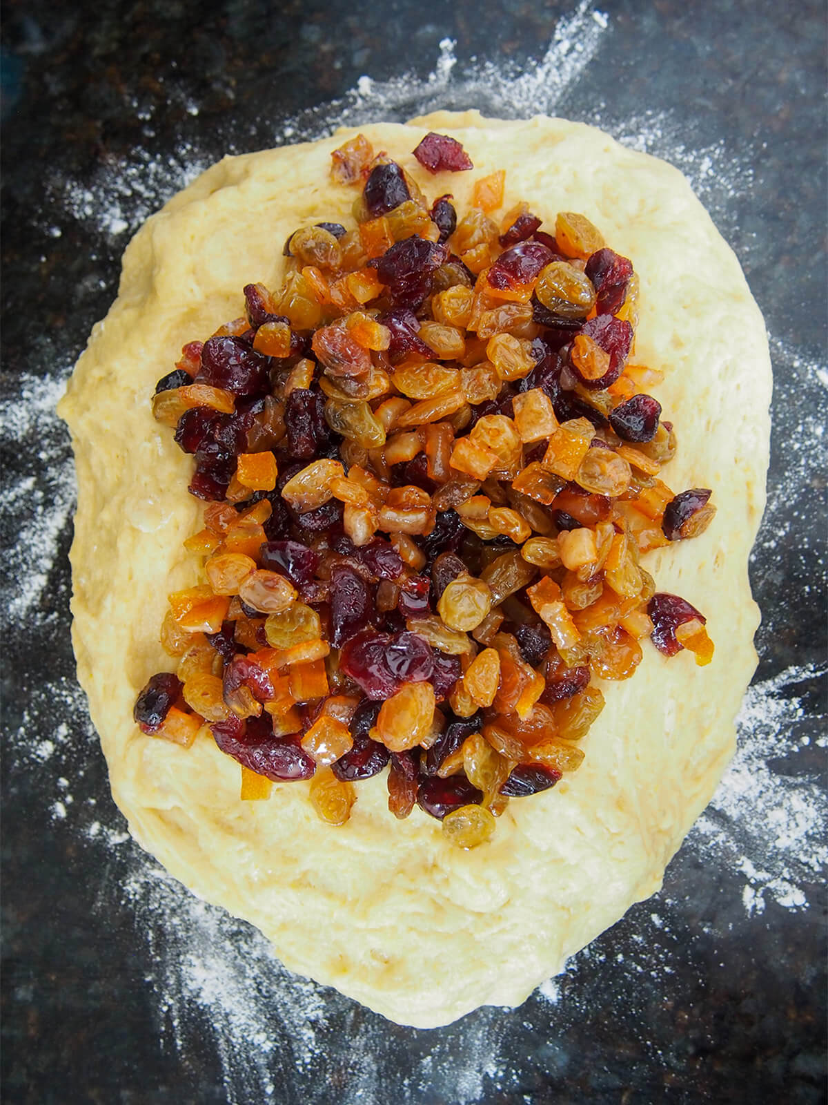 soaked dried fruit on top of dough