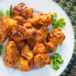 close view of cauliflower pakora on plate