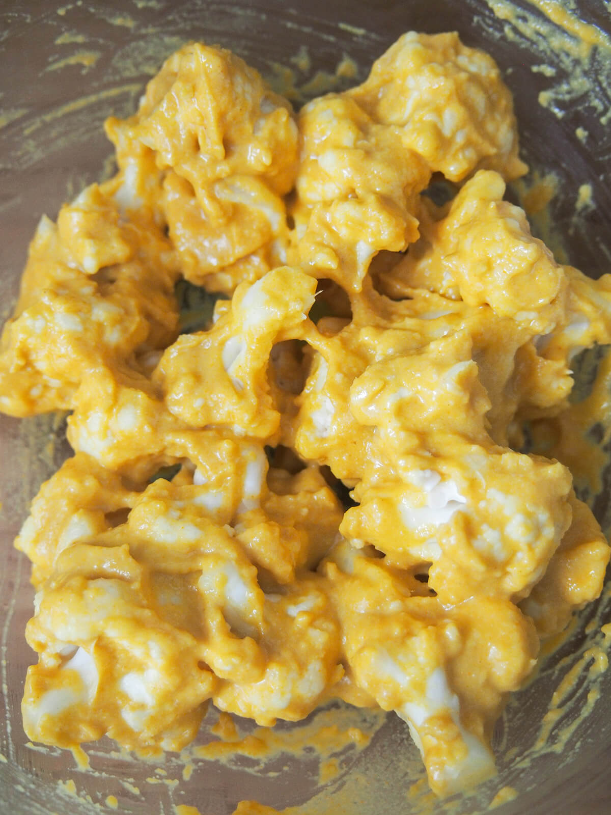 cauliflower in pakora batter pieces of cauliflower in spice and gram flour batter