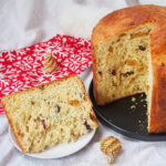 slice of panettone to side of plate with rest