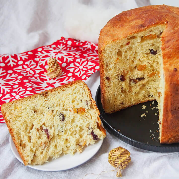 slice of panettone to side of plate with rest