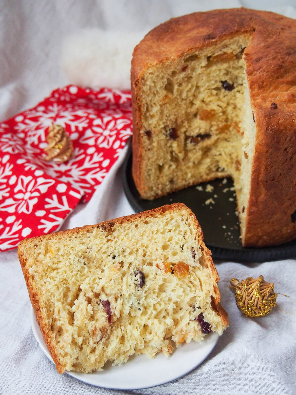 slice of panettone in front of rest of loaf