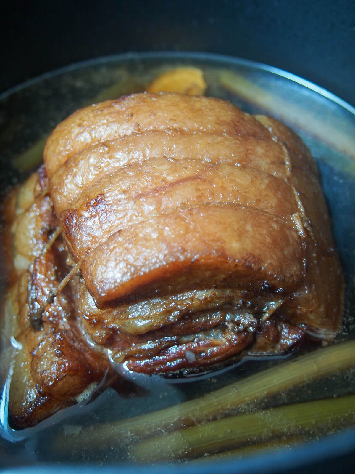 pork belly after braising sitting in braising liquid