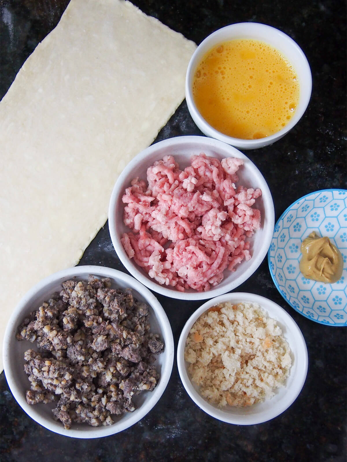 piece of puff pastry, dishes with haggis, pork, breadcrumbs and beaten egg