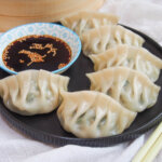 plate of pork and chive dumplings
