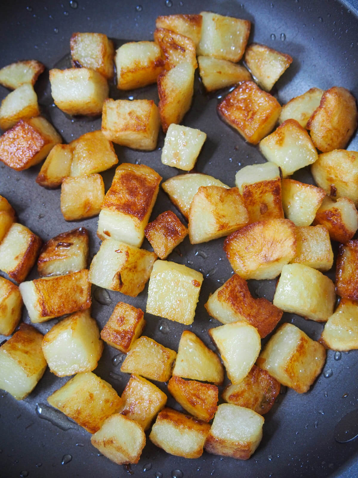 cooking potatoes for aloo chaat frying potatoes in skillet