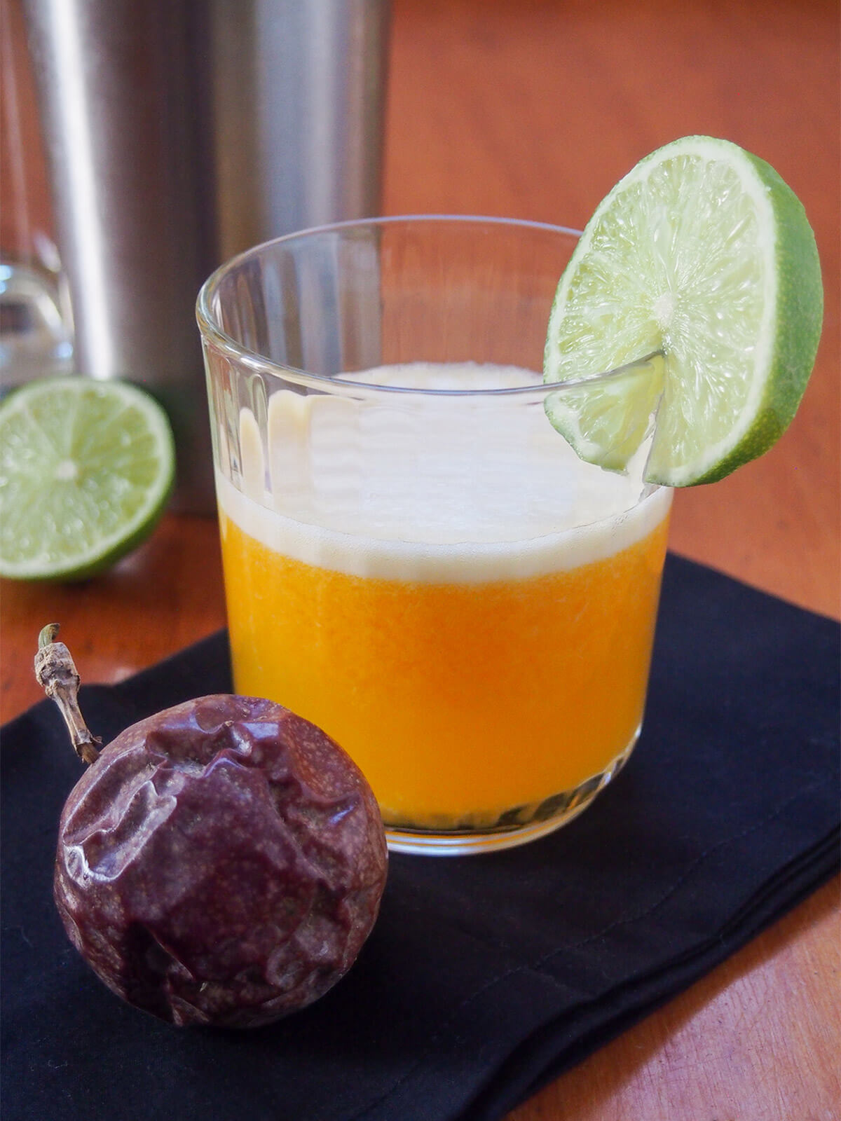 glass of maracuya sour with passion fruit in front