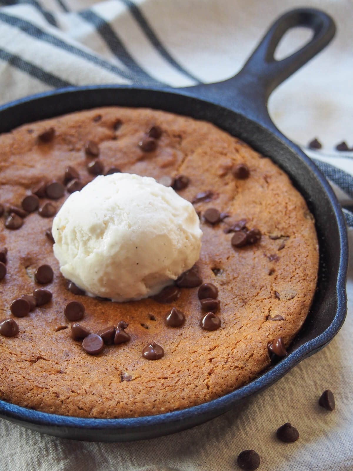 side view of mini skillet cookie topped with ice cream