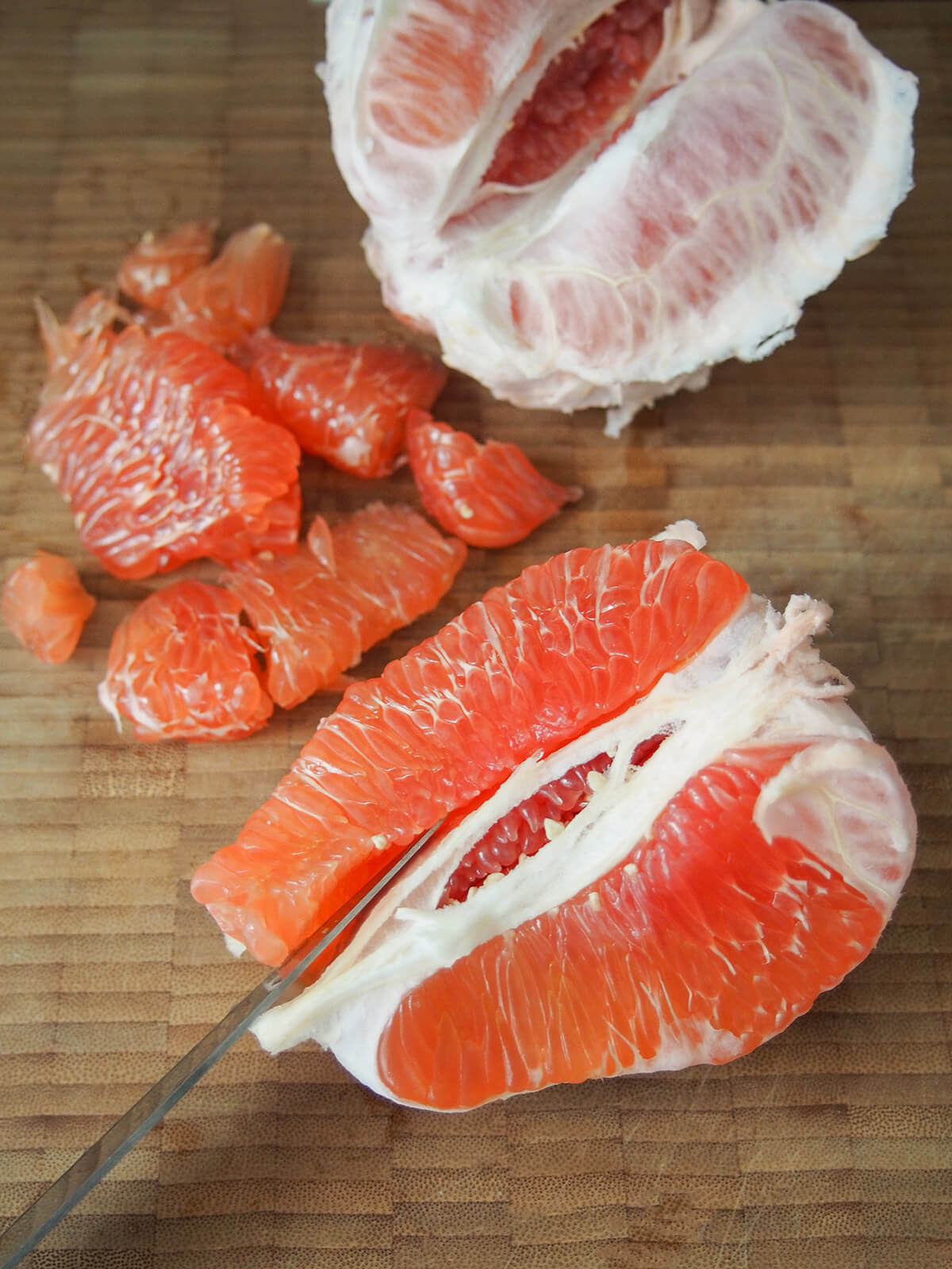 separating segment from chunk of pomelo