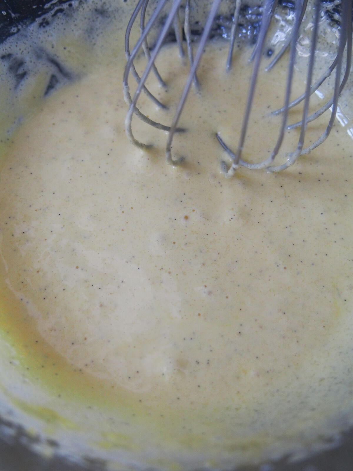 beaten egg and sugar for Persian walnut cookies beaten egg yolk, sugar and vanilla mixture