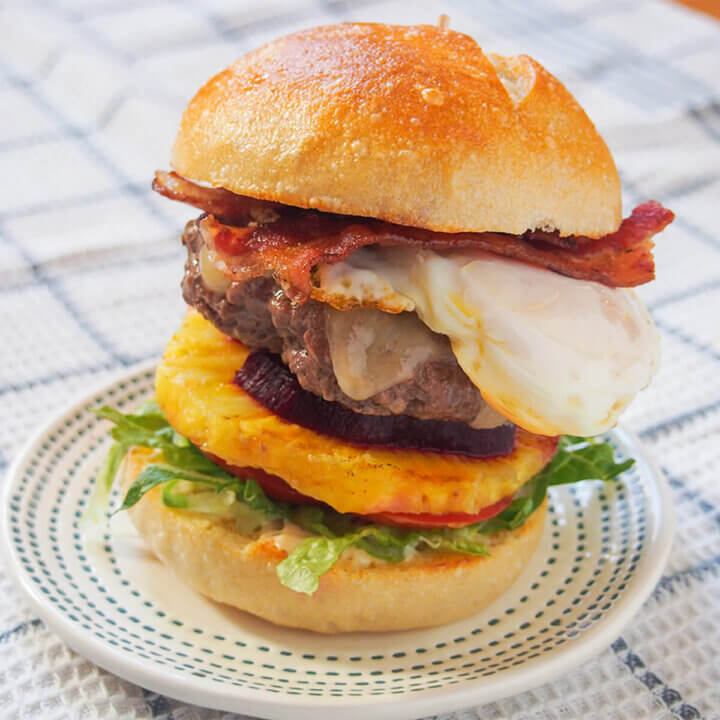 Aussie burger stacked with egg, pineapple, bacon and beetroot