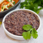 small dish of refried black beans