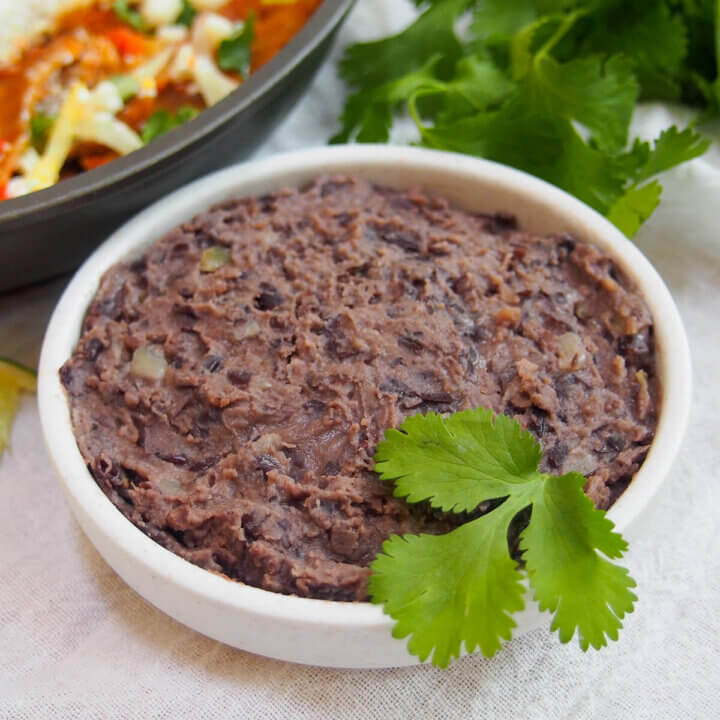 small dish of refried black beans