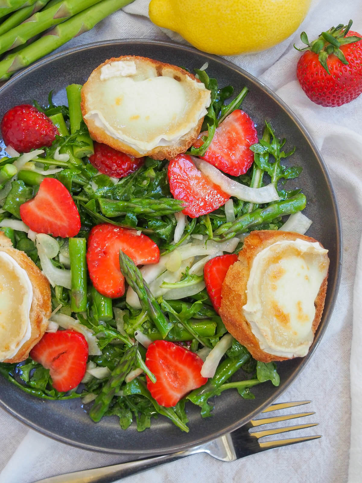 overhead view of strawberry asparagus salad