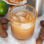 glass of tamarind margarita with chili rim